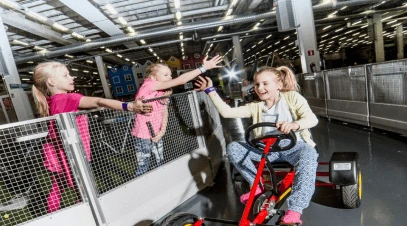 Kids Enjoying Pedal Car Track at SuperPark