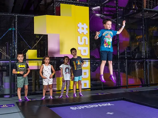 Kids play on the SuperJump trampolines at SuperPark