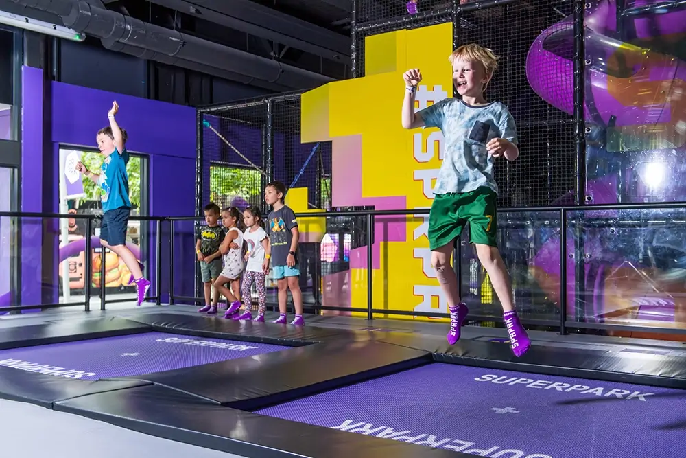 Young boy jumps on the SuperJump interactive trampoline