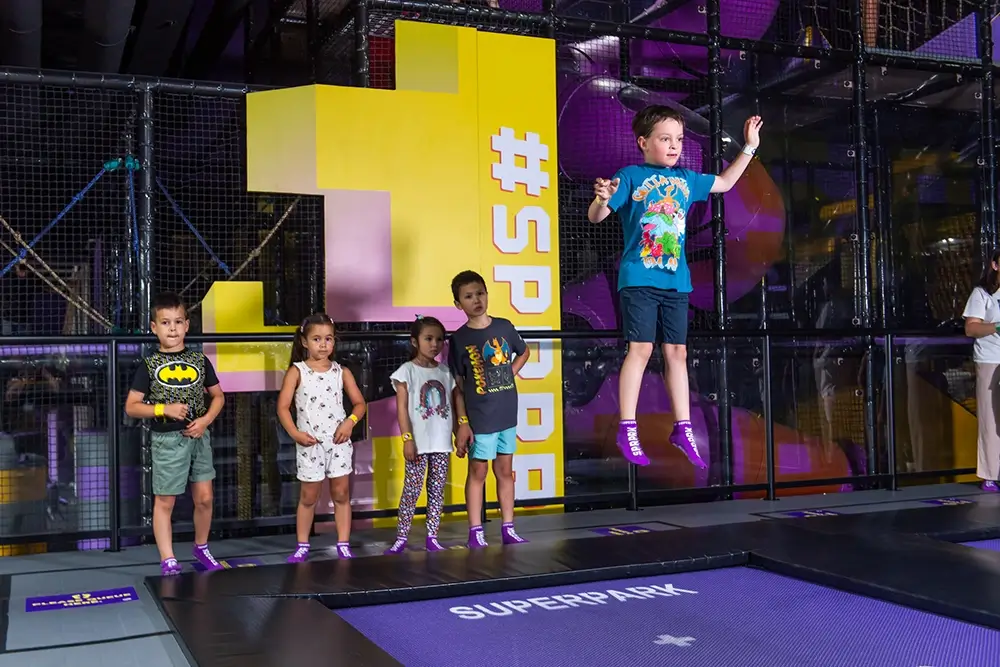 kids play on the SuperJump trampolines at SuperPark