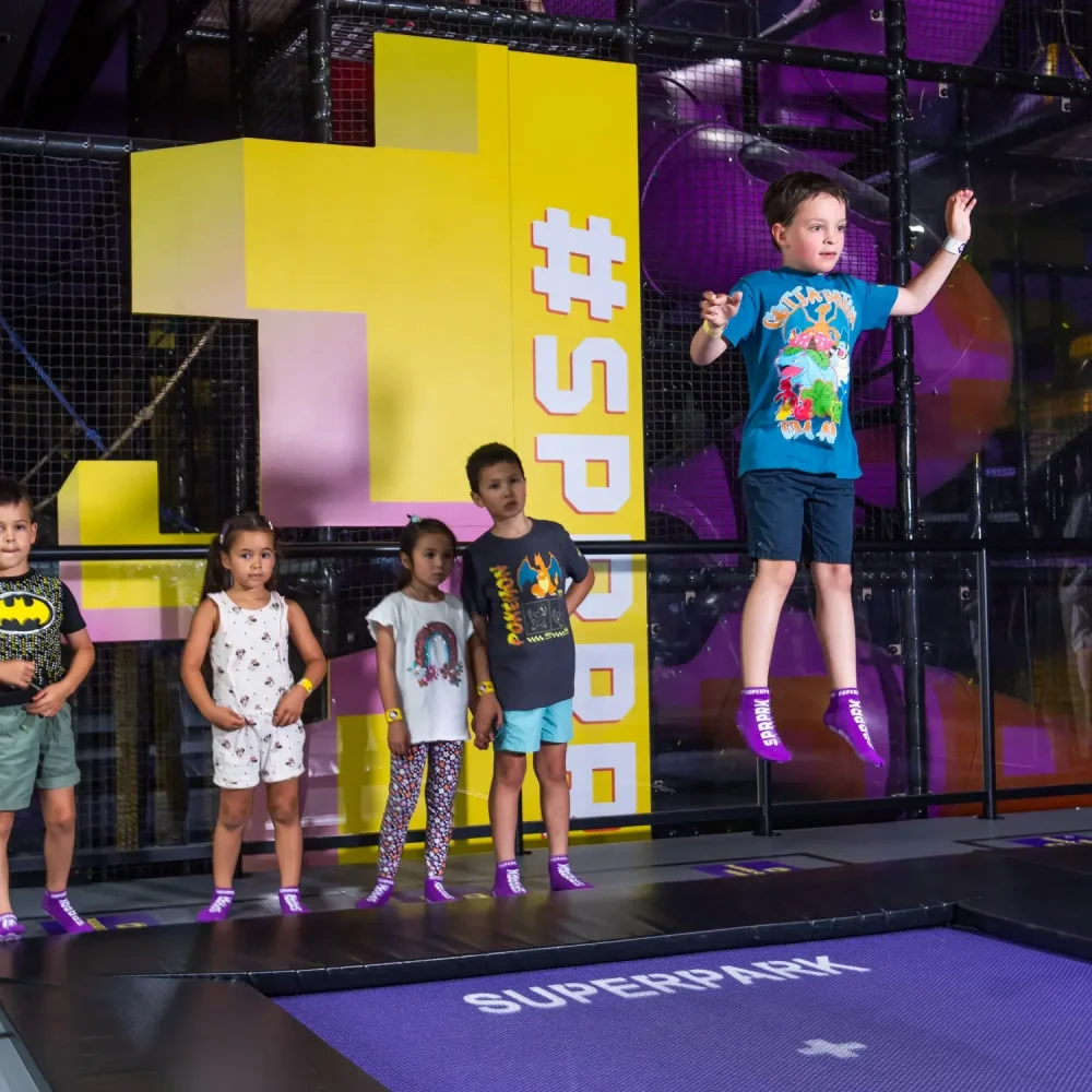 Kids play on the SuperJump trampolines for school holiday fun